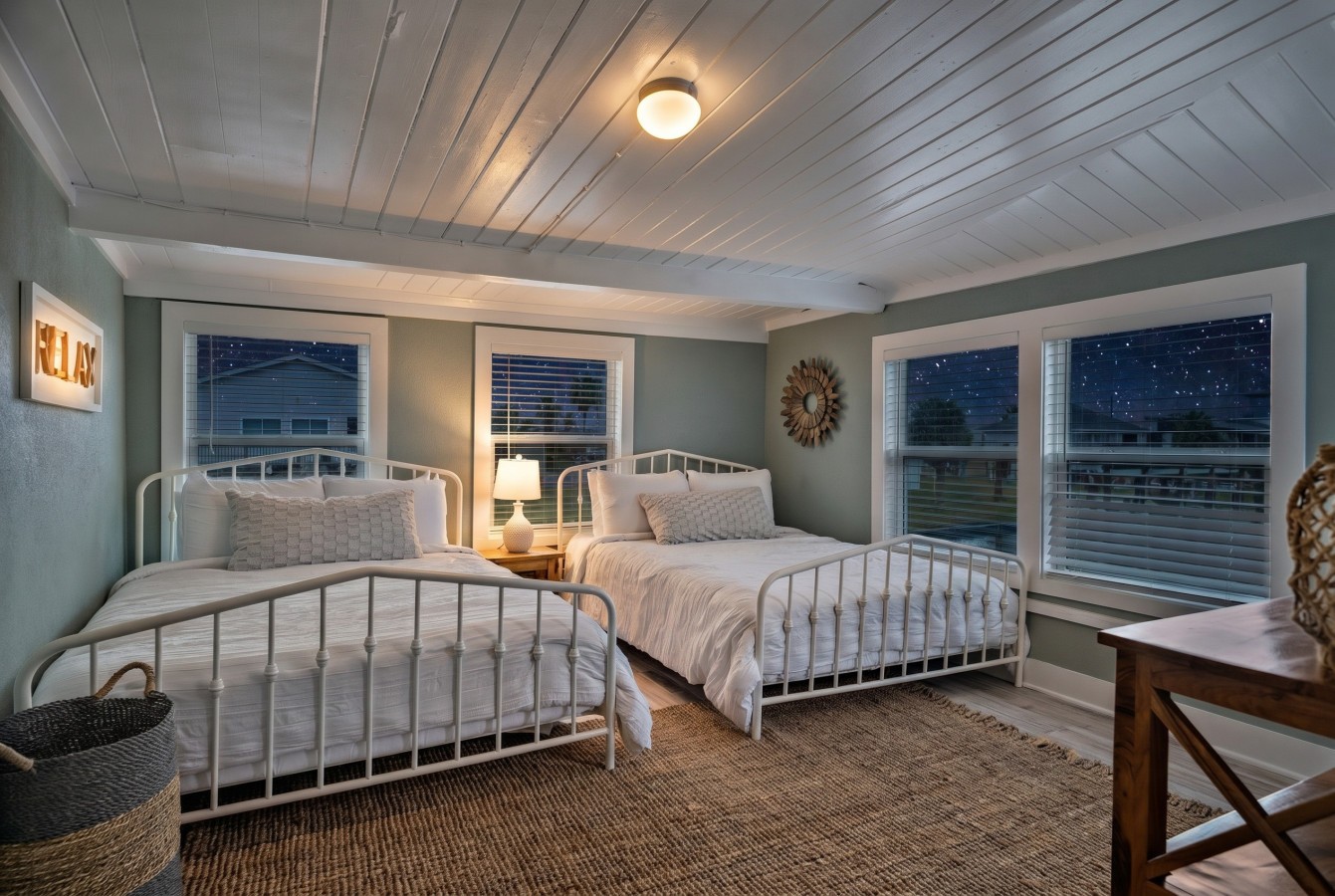 This bedroom has 2 queen beds