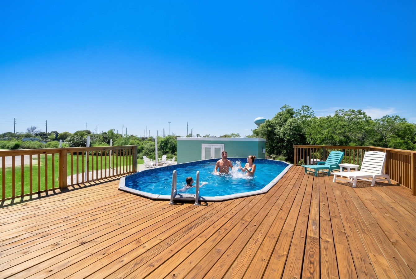 Family fun in the sun by the pool