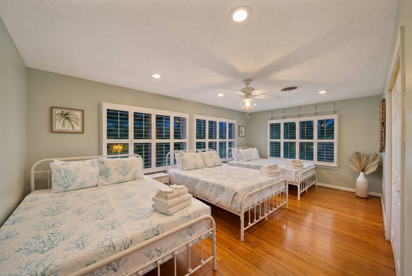 This bedroom has 3 queen sized beds
