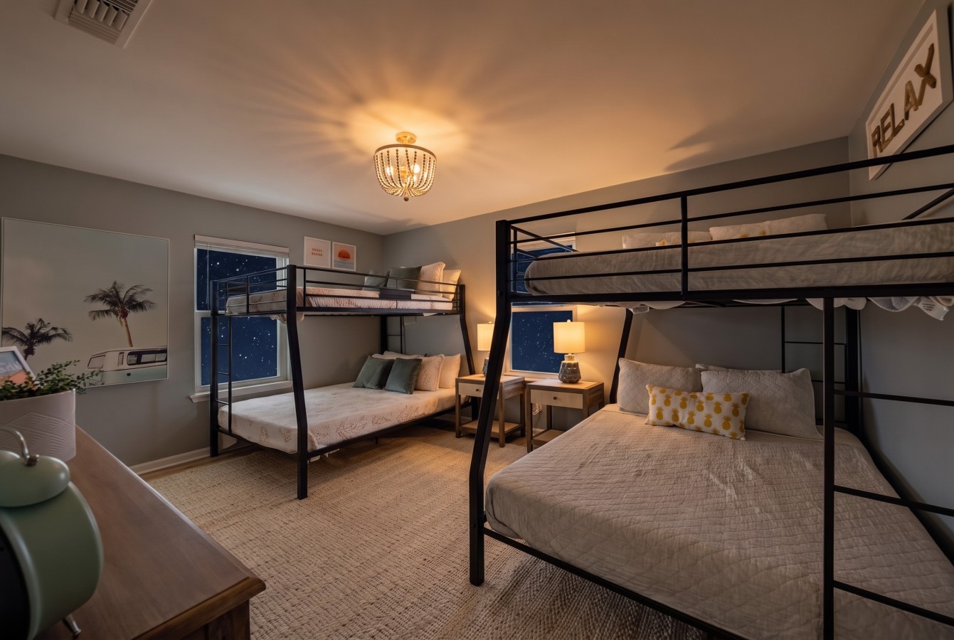 This bedroom has two full-over-queen-size bunk beds