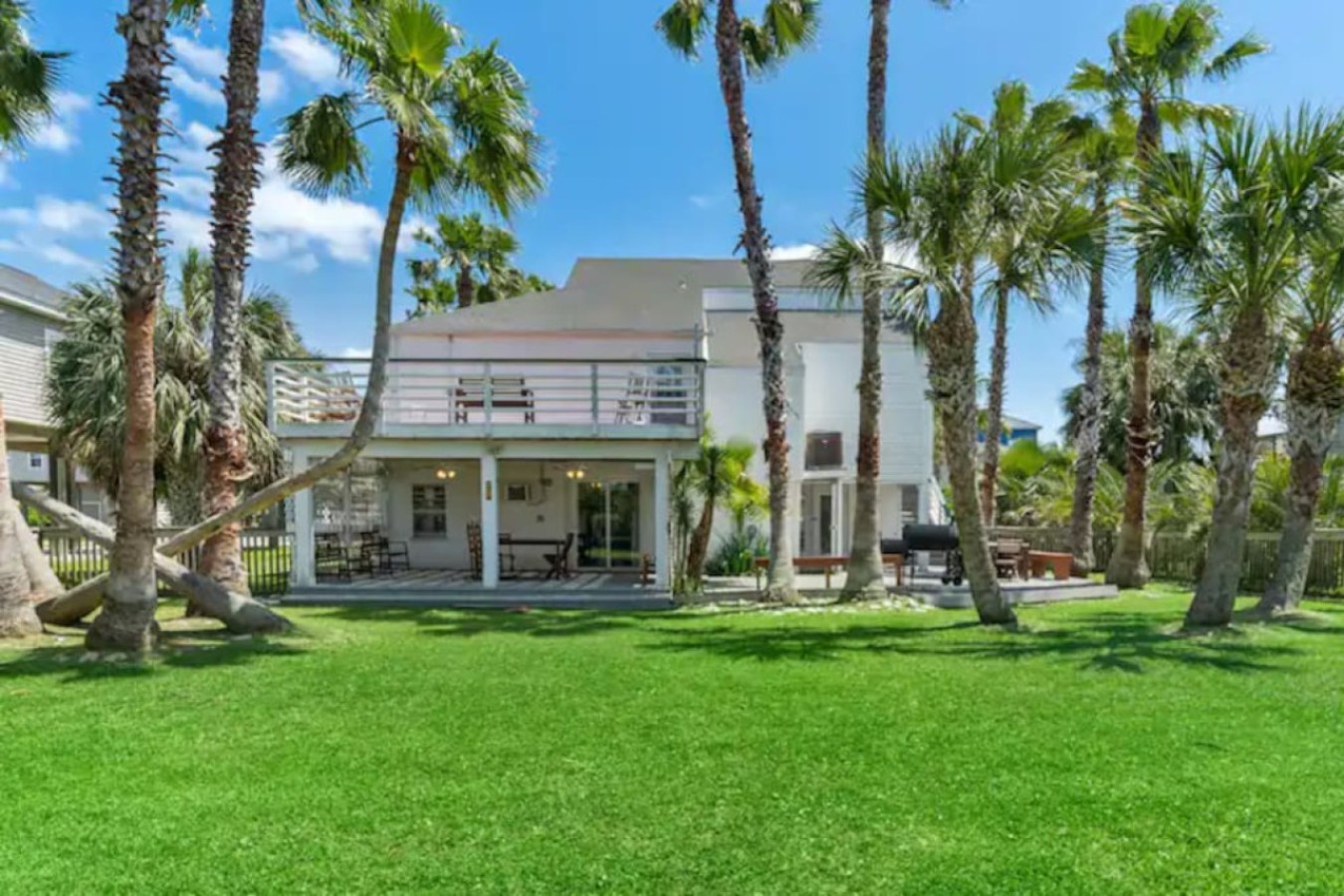 The massive backyard is full-fenced in and has a lively, tropical vibe