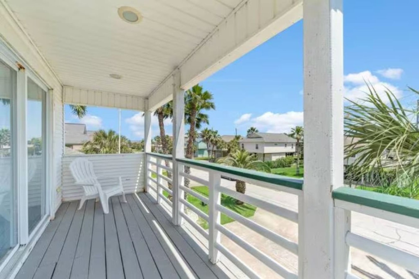 The third-floor master suite has a private balcony