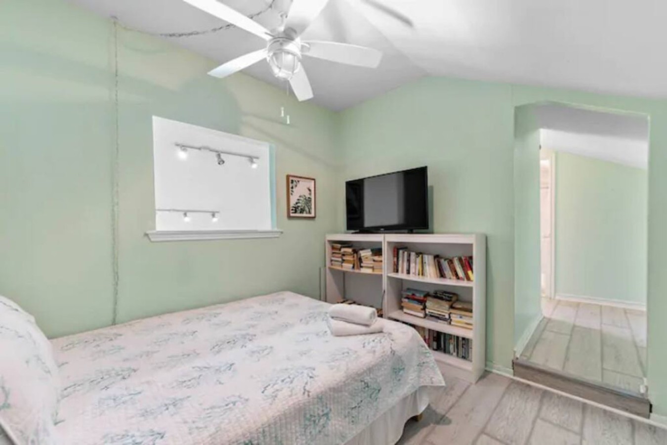 This bedroom on the third level has a queen-sized bed