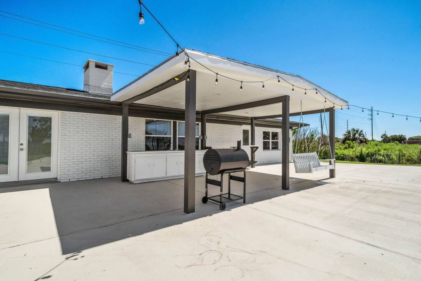 Grill up a feast on the back patio with the BBQ pit