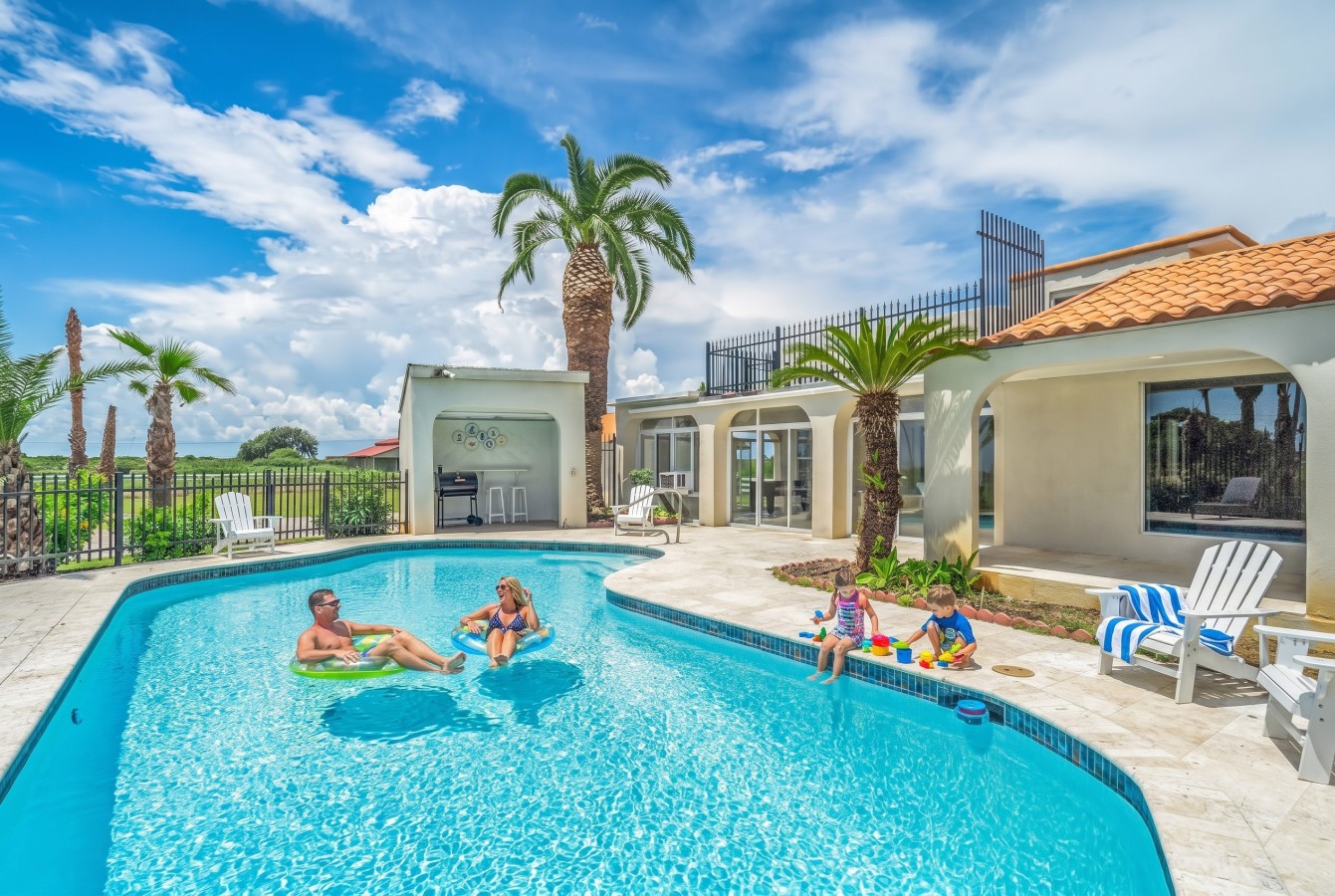 Family fun in the sun by the pool