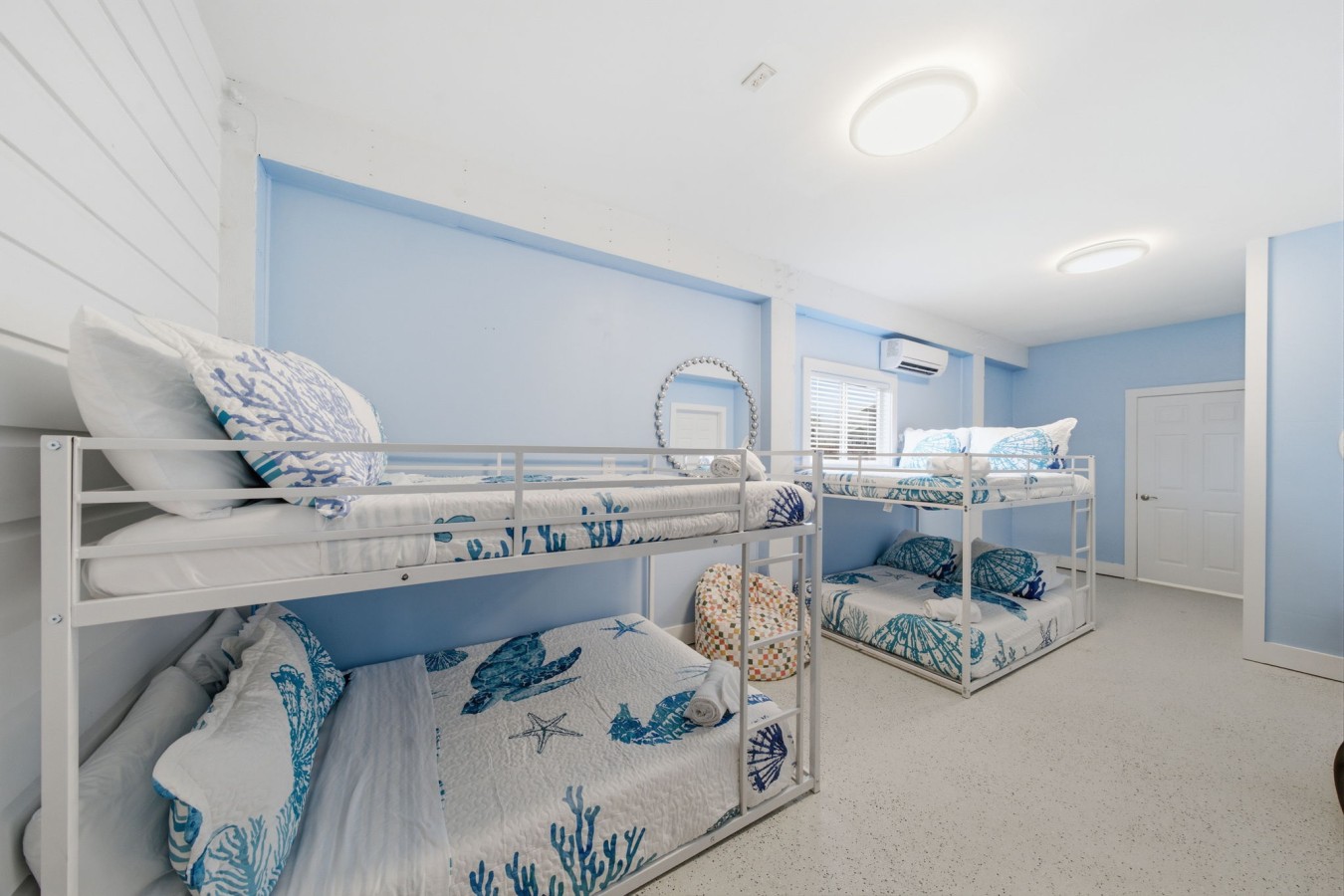 Double the bunks & double the fun in this coastal room
