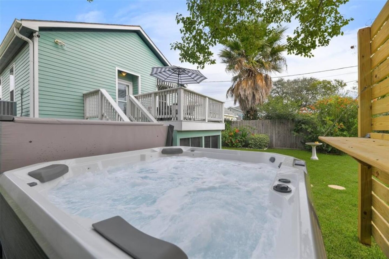 Relax under the stars in this bubbling hot tub