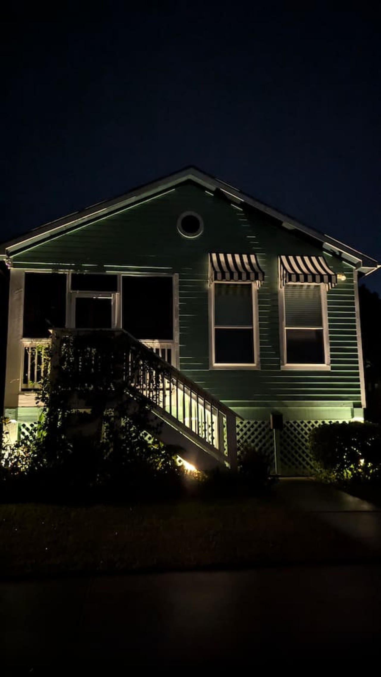 Evenings feel magical with this home lit up at night