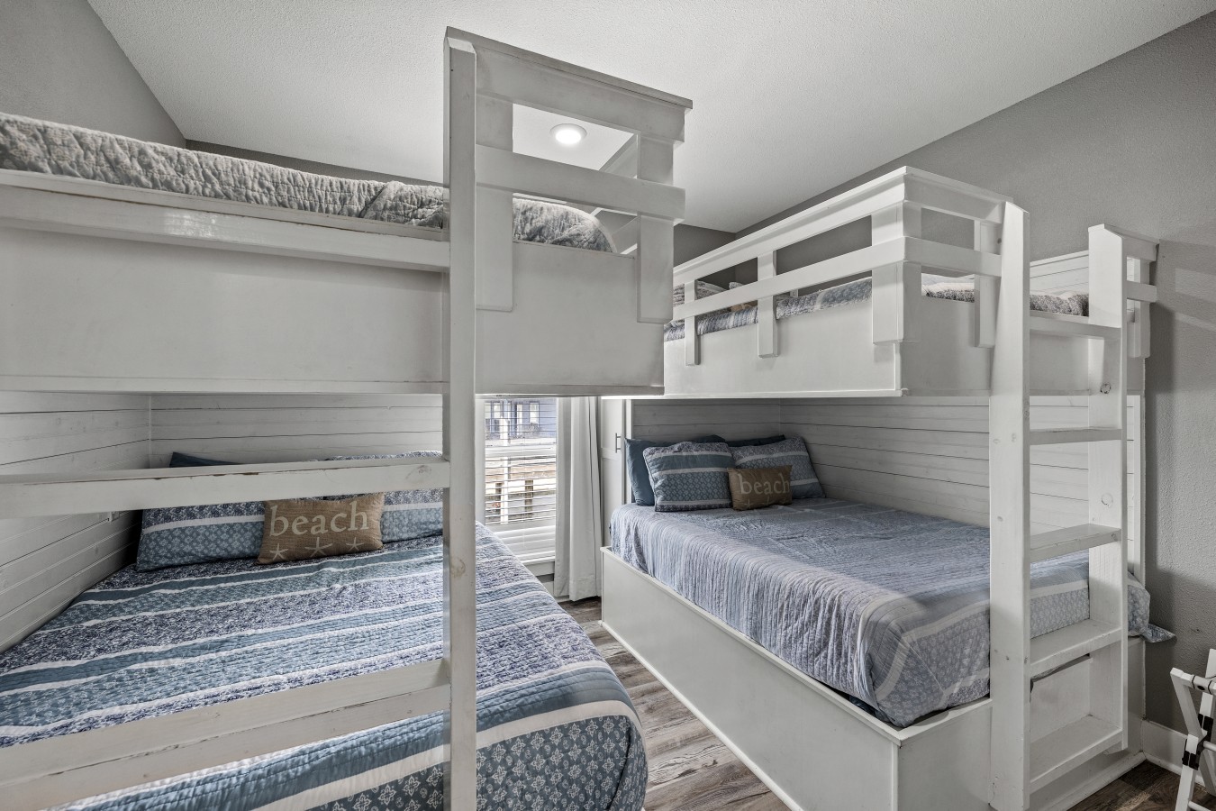 This bedroom has 2 full over full bunk beds