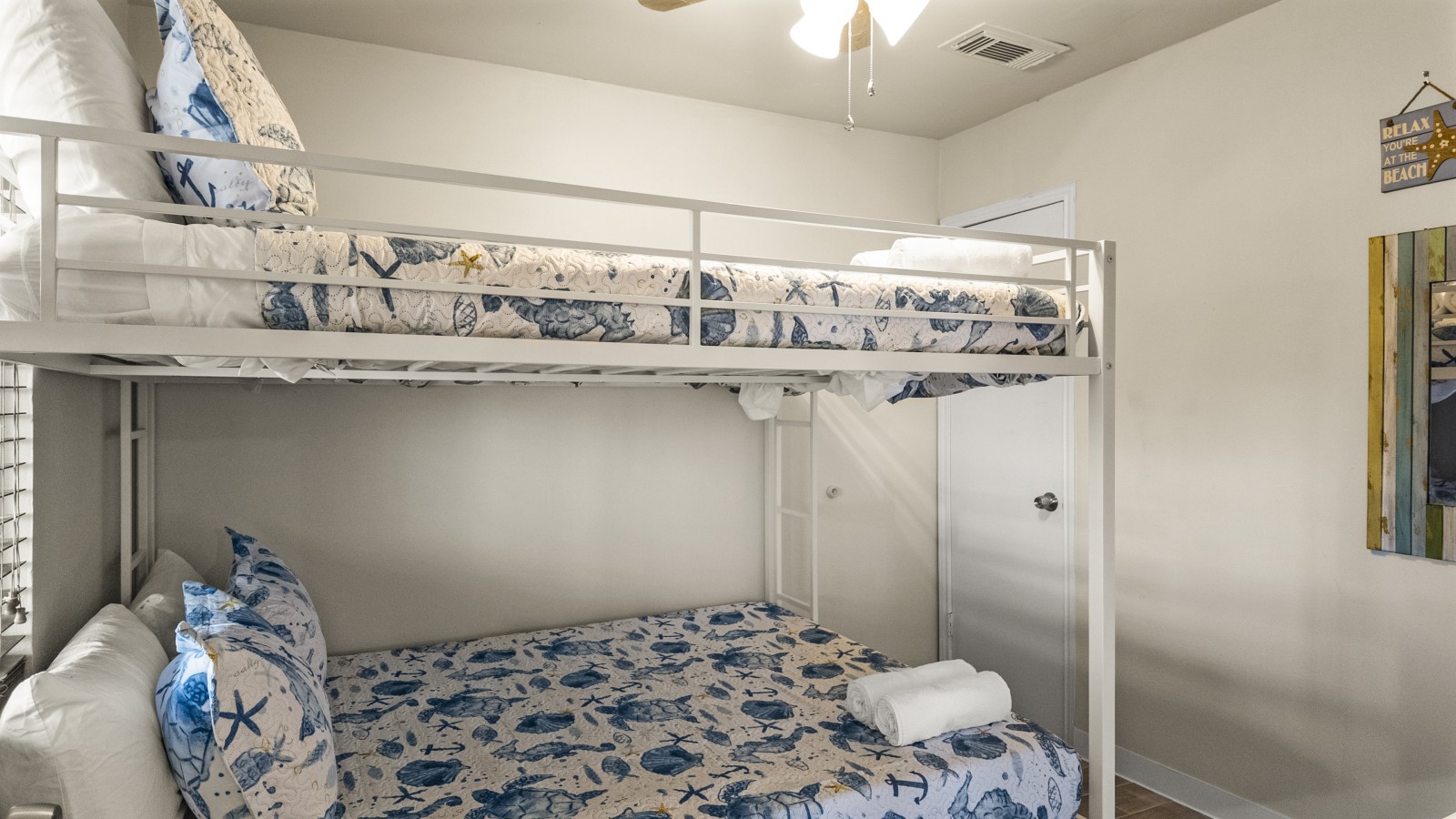 This bedroom has a queen over queen bunk bed