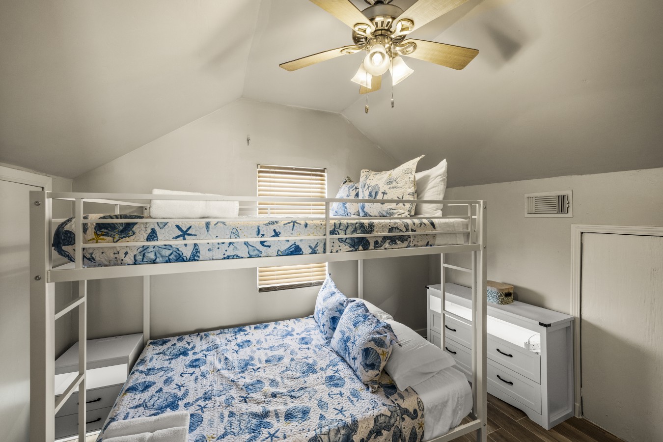 This bedroom has a queen over queen bunk bed