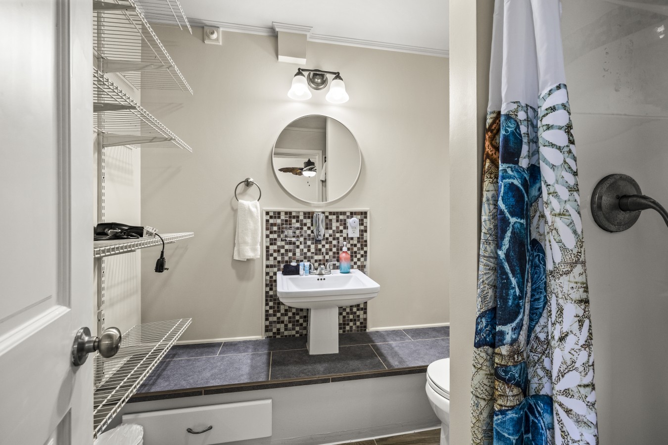 Unwind in this beautiful bathroom after a day at the beach