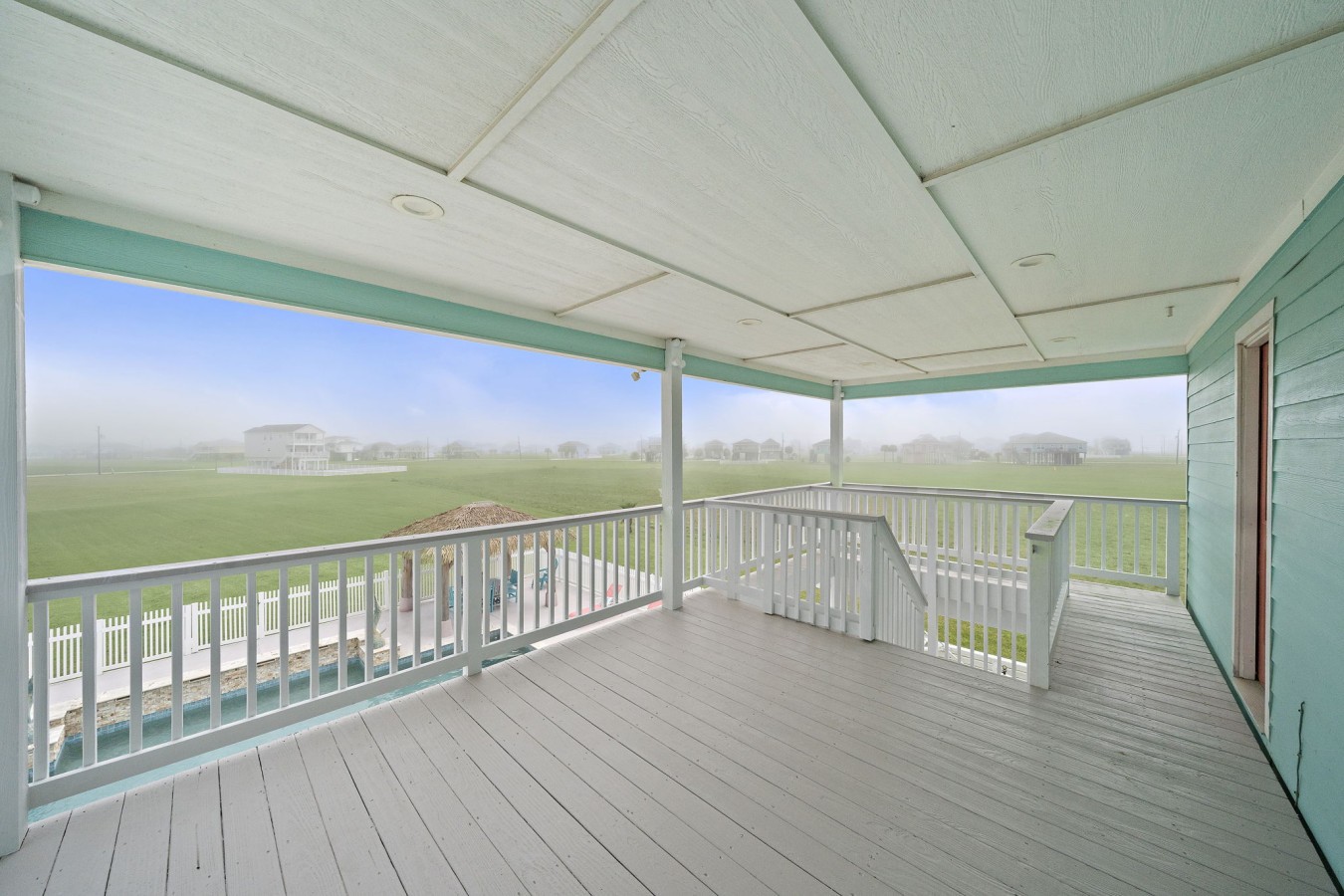 Relax on the shaded deck with peaceful neighborhood views