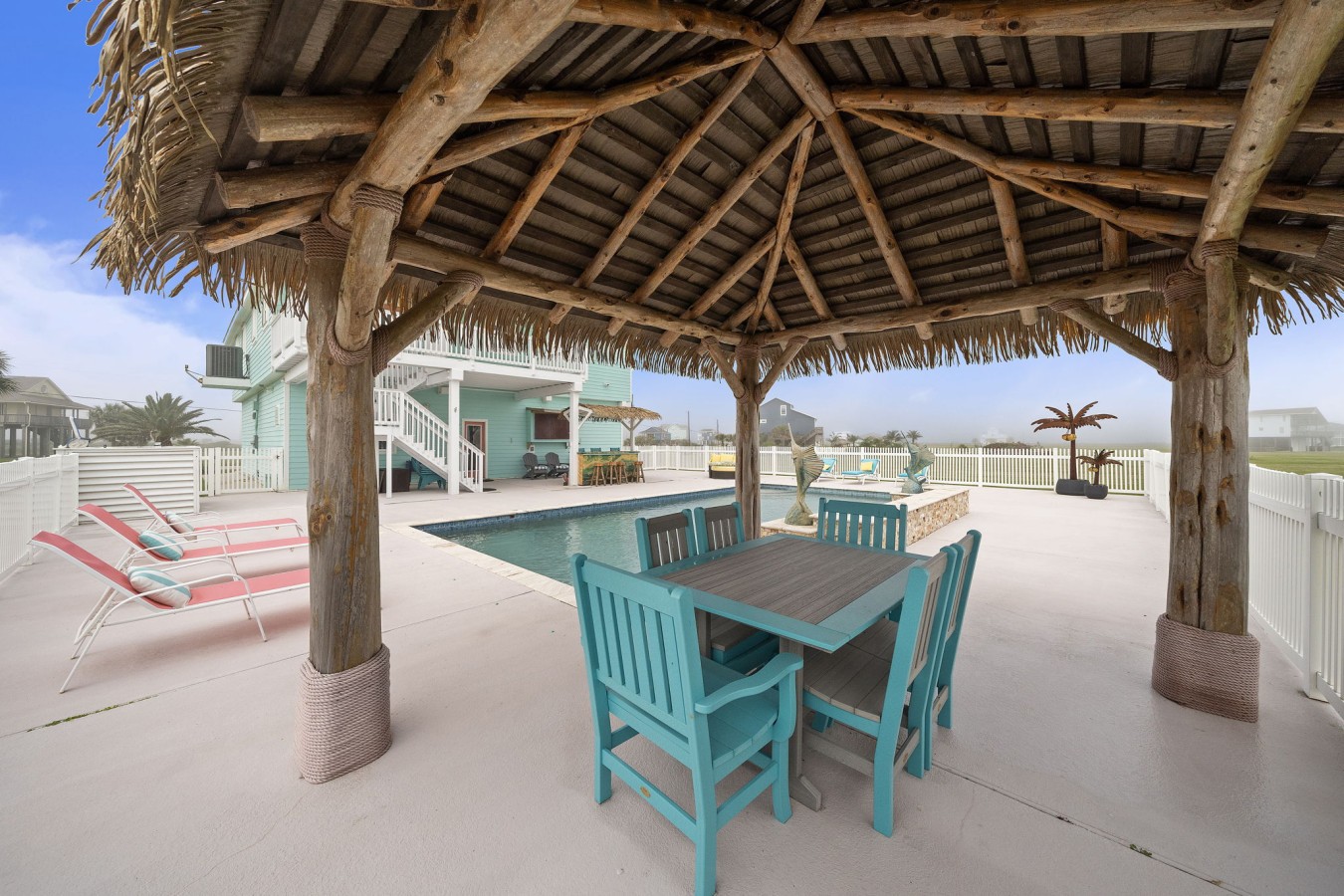 Covered tiki hut with poolside dining