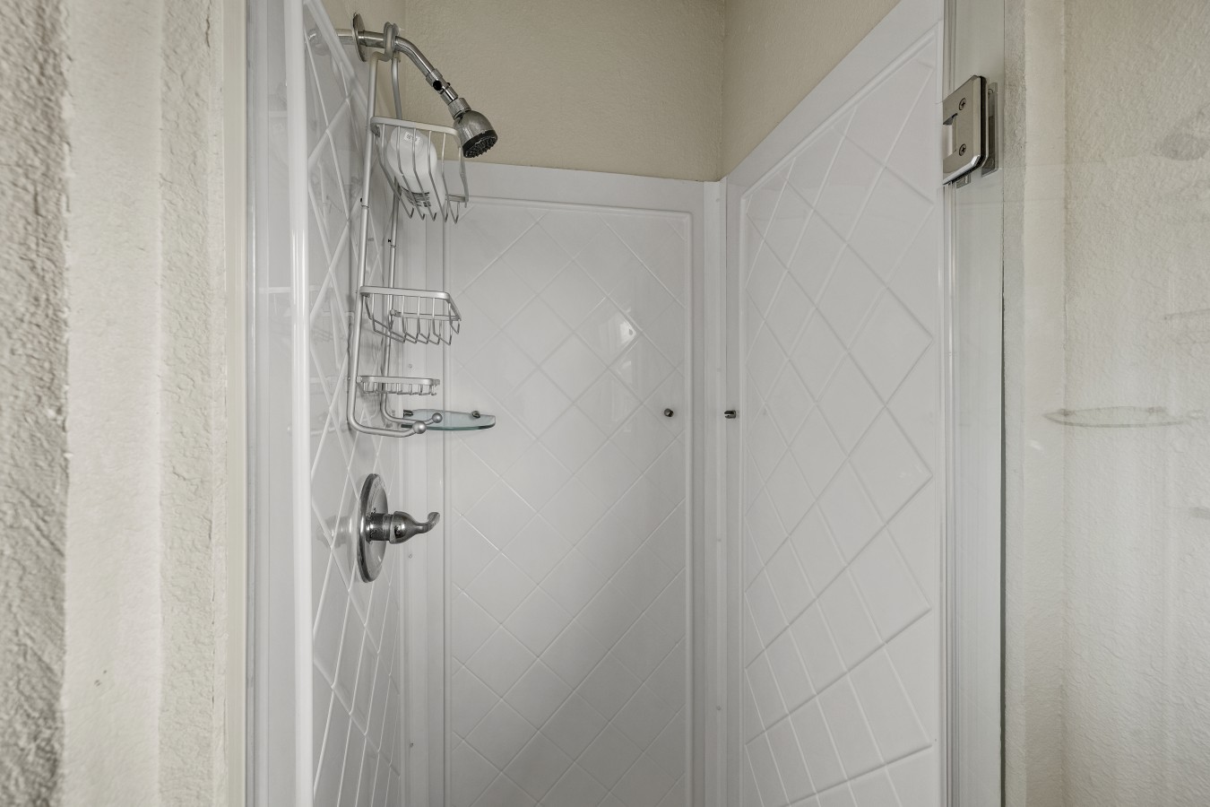 Unwind in this beautiful bathroom after a day at the beach