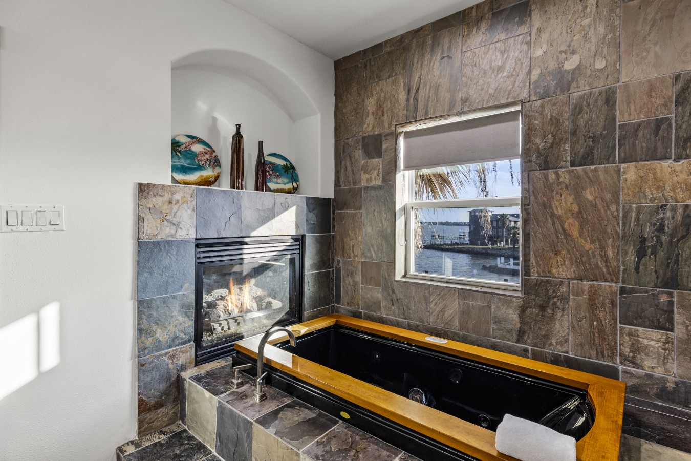 Relax in the tub by the cozy fireplace