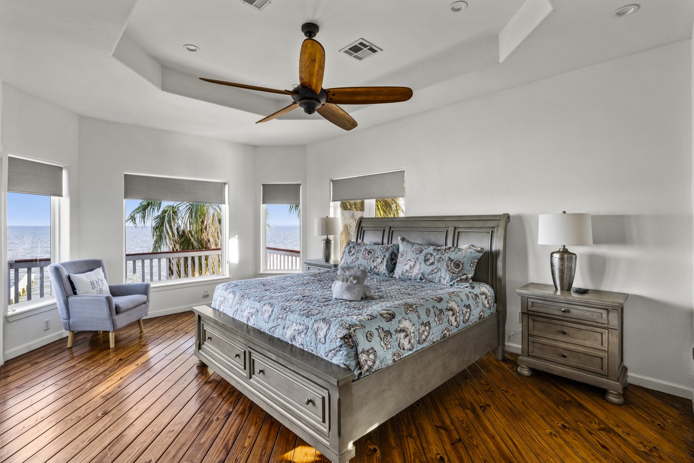 This bedroom has a king-sized bed and a queen sofa bed