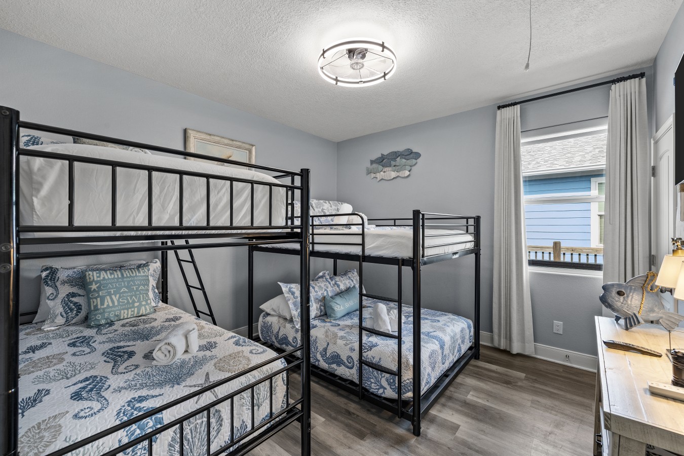 This bedroom has two queen over queen bunk beds
