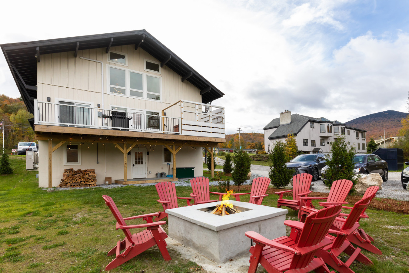 Exterior view of house with balcony and yard.