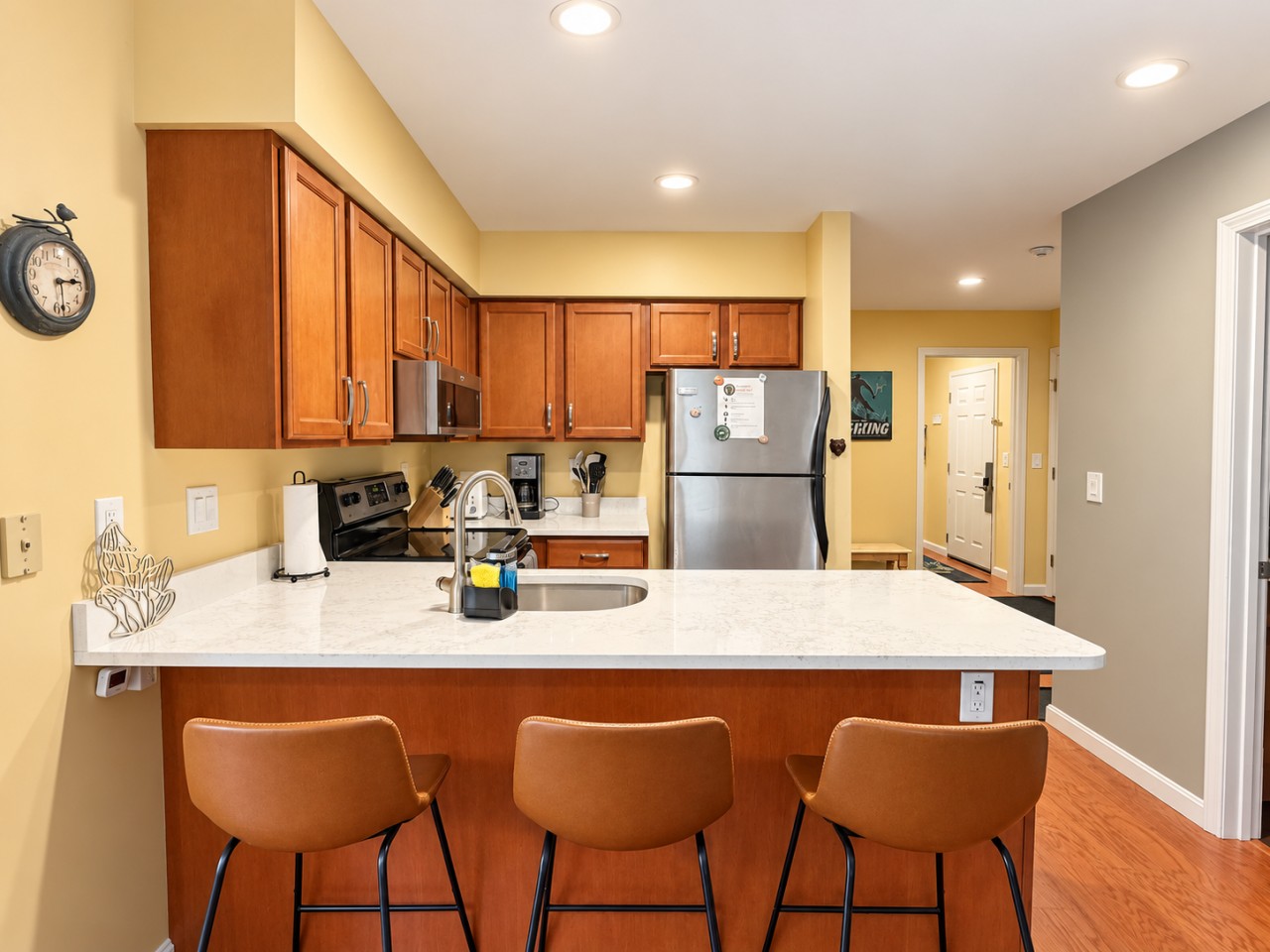 Step into our glamorous kitchen, complete with a sleek refrigerator and elegant table