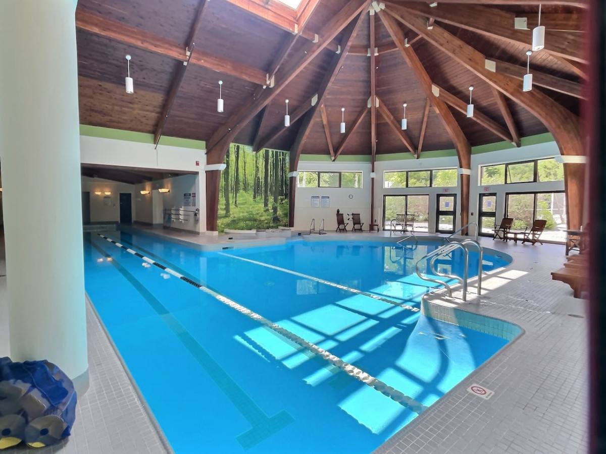 Spa at the Woods - Relax in our spacious indoor pool with limited hours for an exclusive experience.