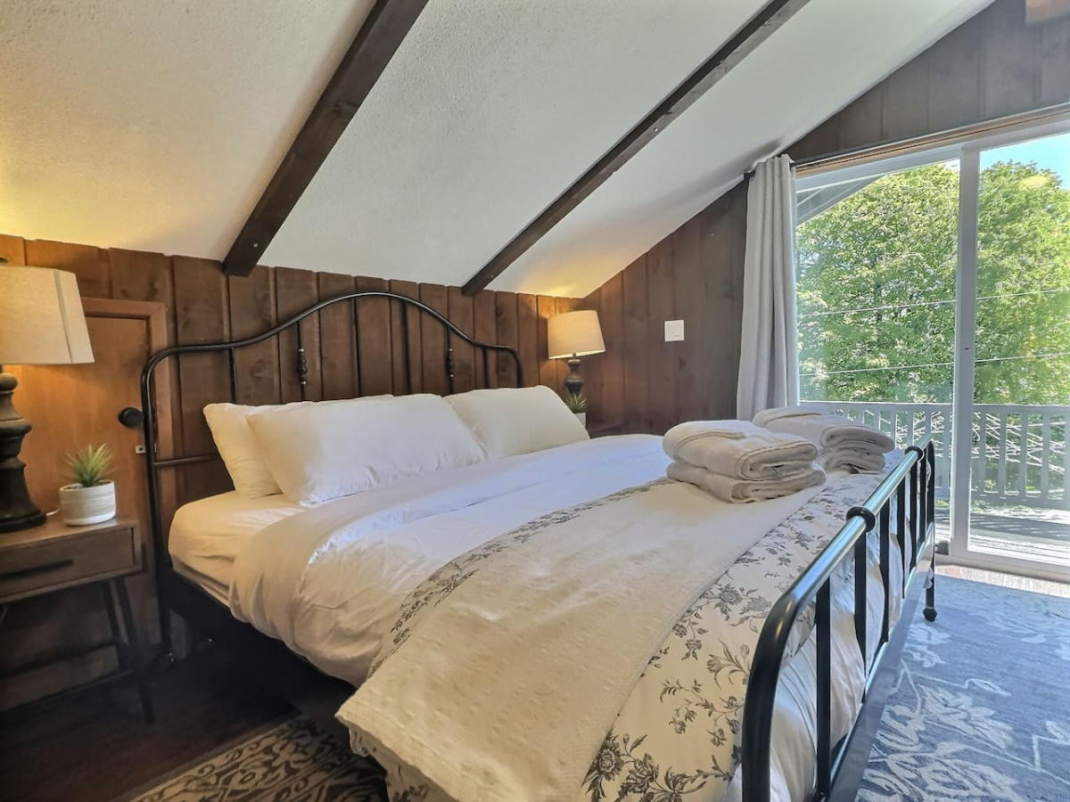 Relax in a king-sized bedroom with sliding door access to the outdoor terrace.