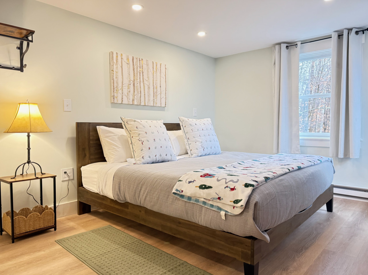 Rest easy in this stylish bedroom featuring a king-sized bed