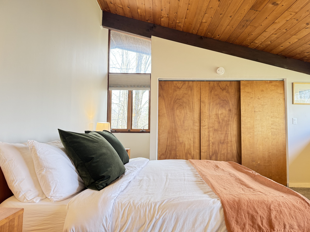 Wake up to peaceful forest views from the comfort of a plush bed.