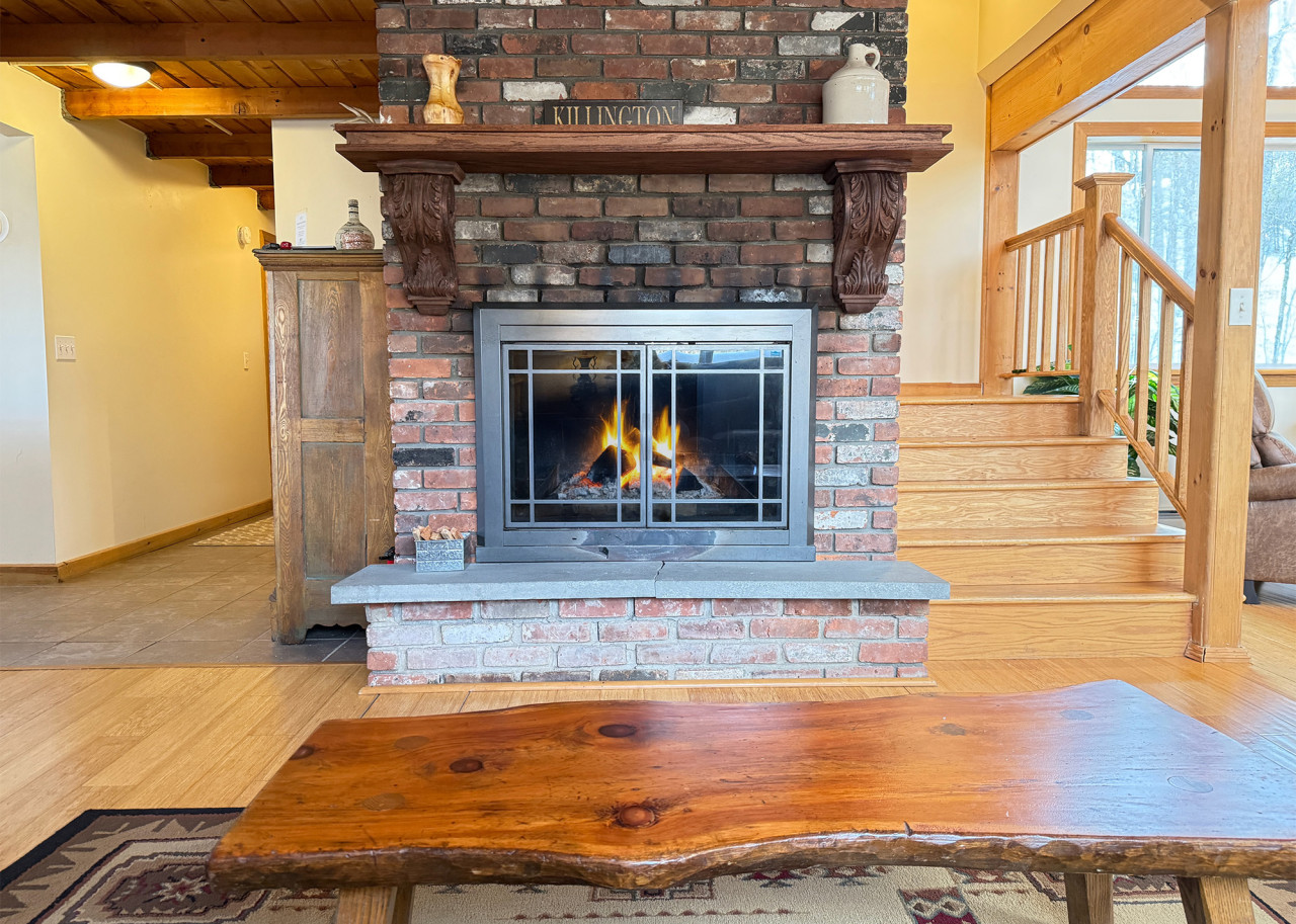 Relax in this warm space featuring a fireplace for cozy mountain evenings.