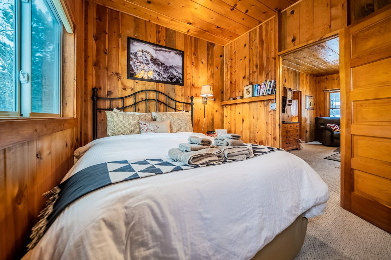 Are you ready for a cozy night in? Let this vintage cabin bedroom be your retreat from the hustle of everyday life! Spend your night in this rustic paradise and let your excitement take over.