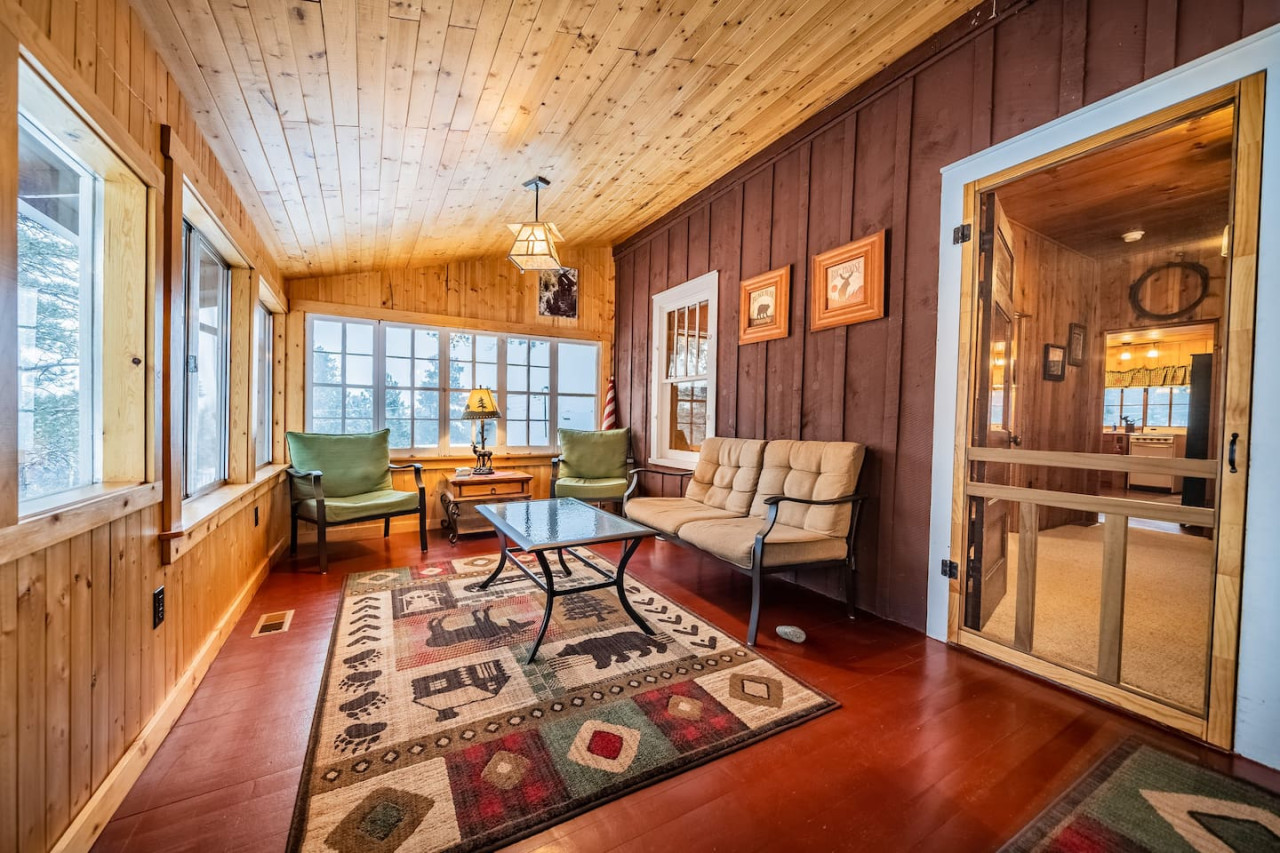 There's a spacious sun porch with windows, a seating area and an eating area. This is a great place to hang out in the summers, though in winter it is not heated.