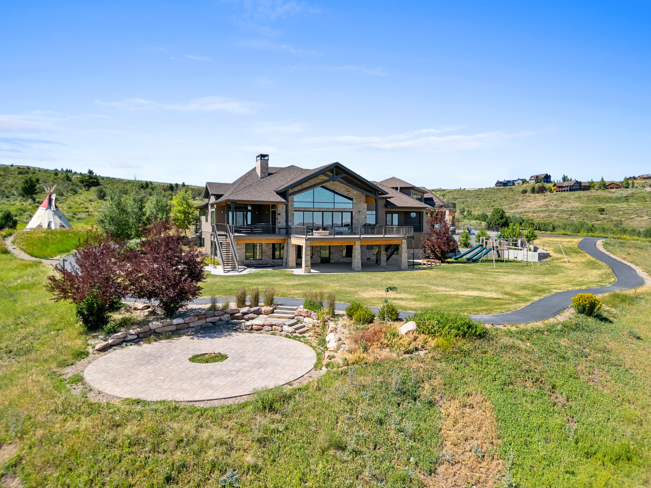 Spacious Back Deck with Firepit, Grill, Smoker and Tables. Back Yard and patio.