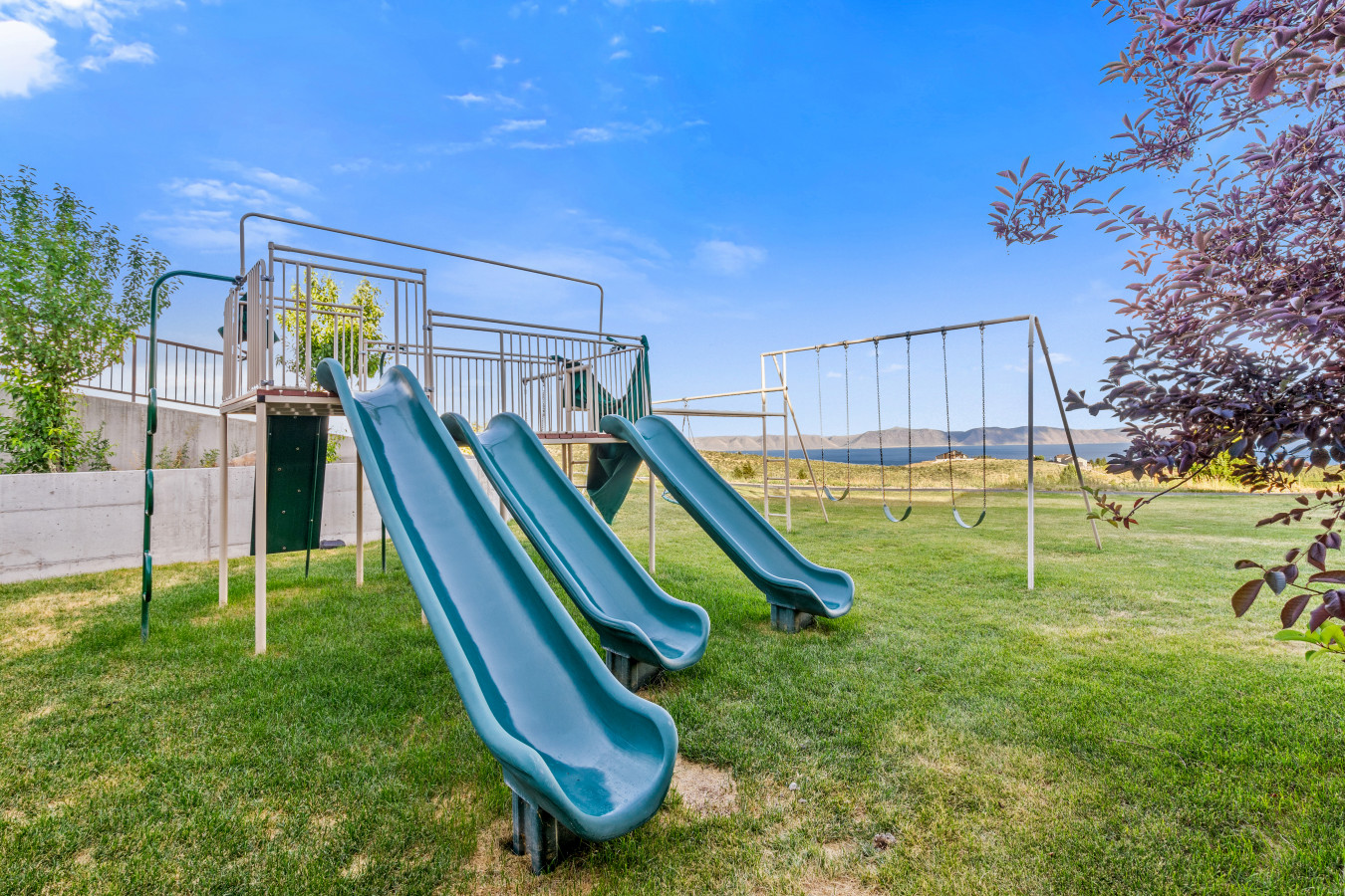 Spacious Back Deck with Firepit, Grill, Smoker and Tables. Back Yard and patio.