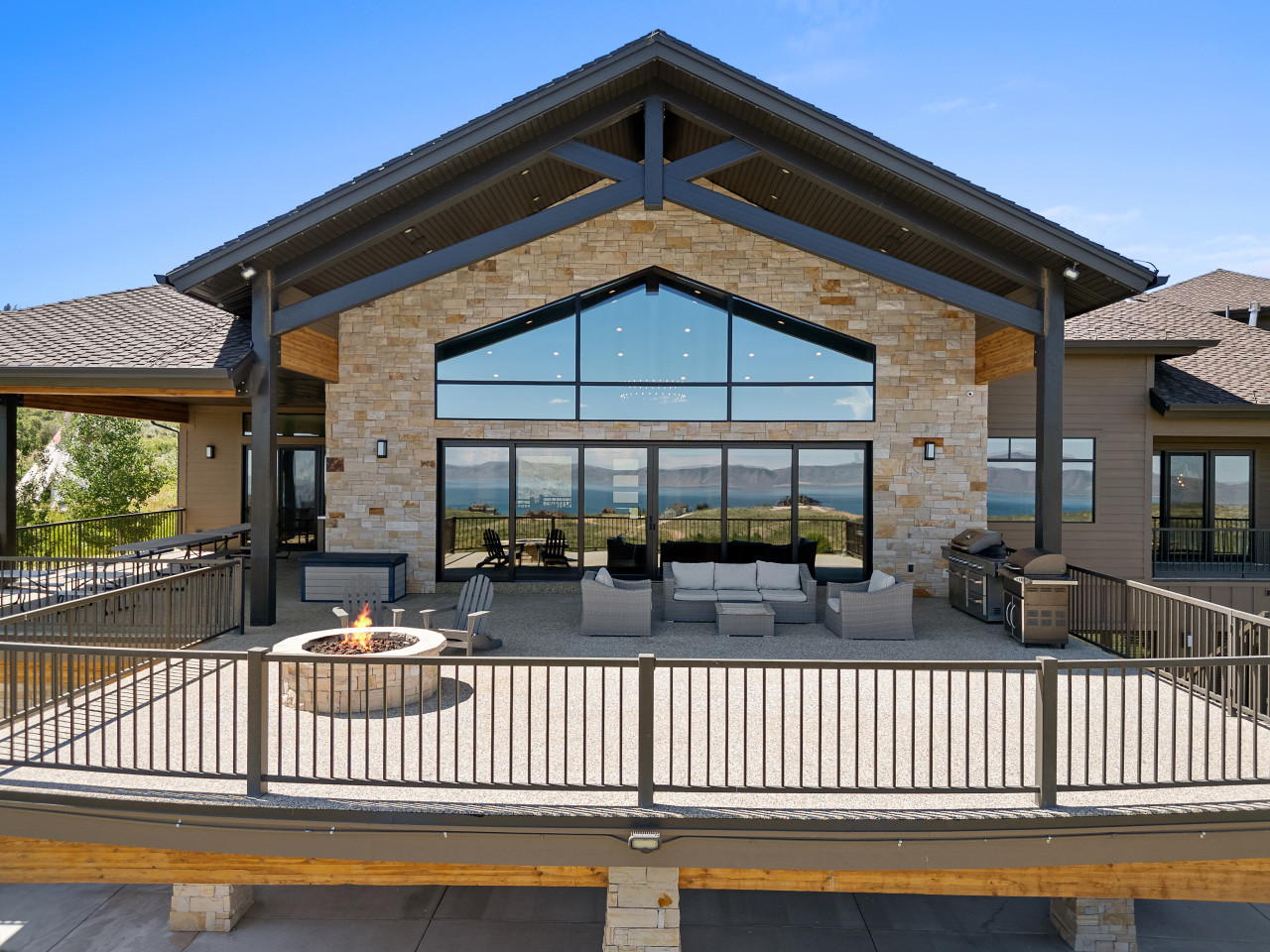 Spacious Back Deck with Firepit, Grill, Smoker and Tables. Back Yard and patio.