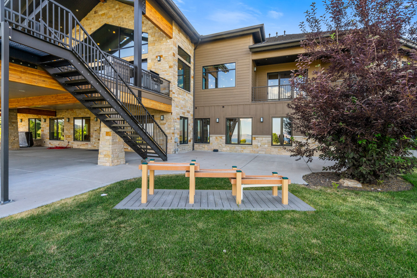 Spacious Back Deck with Firepit, Grill, Smoker and Tables. Back Yard and patio.