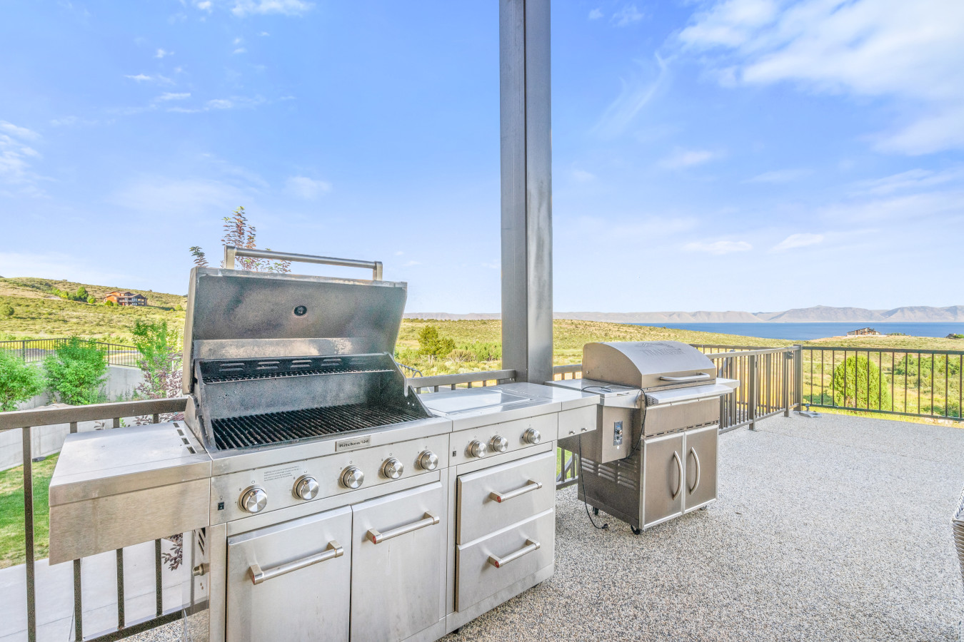 Spacious Back Deck with Firepit, Grill, Smoker and Tables. Back Yard and patio.