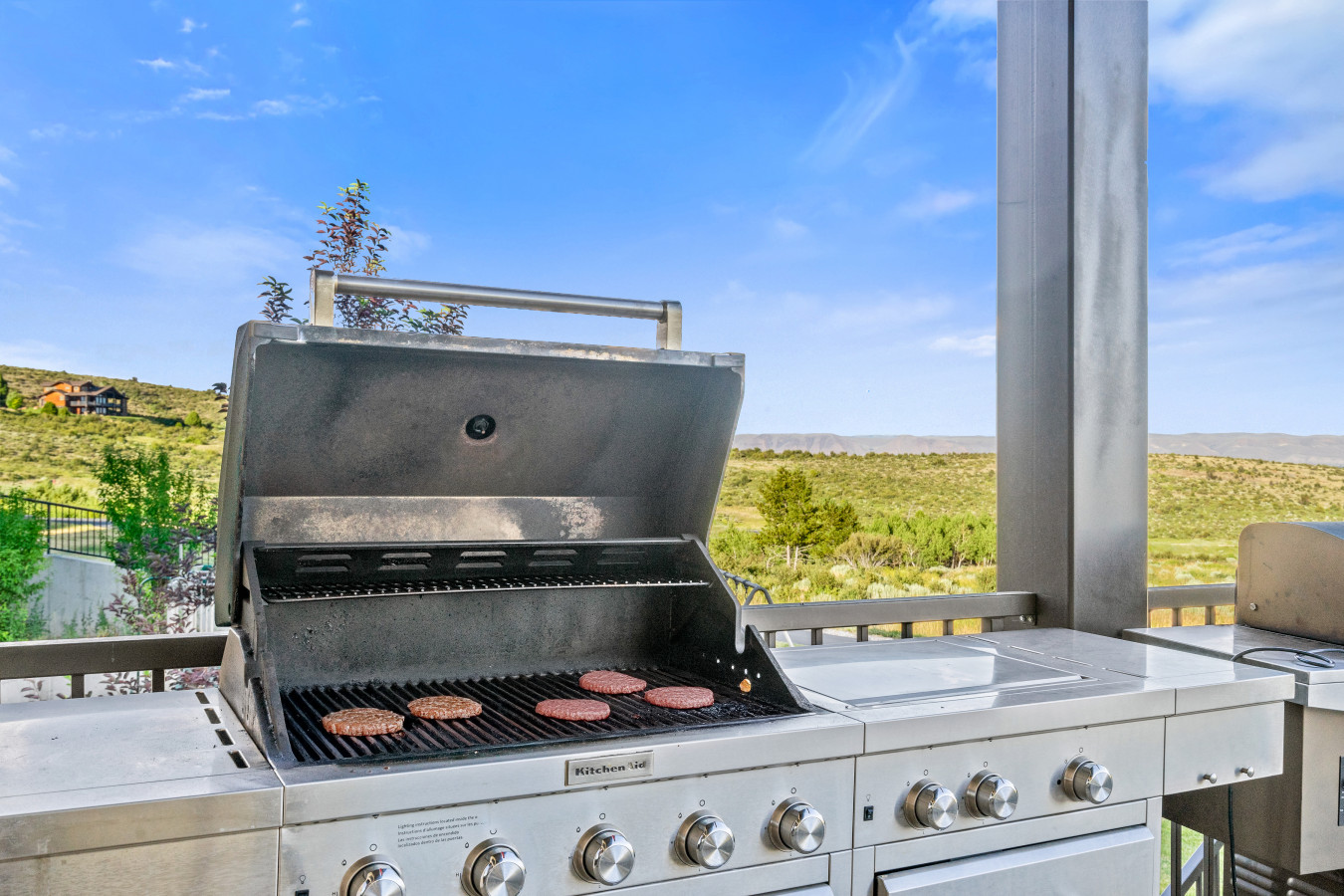 Spacious Back Deck with Firepit, Grill, Smoker and Tables. Back Yard and patio.