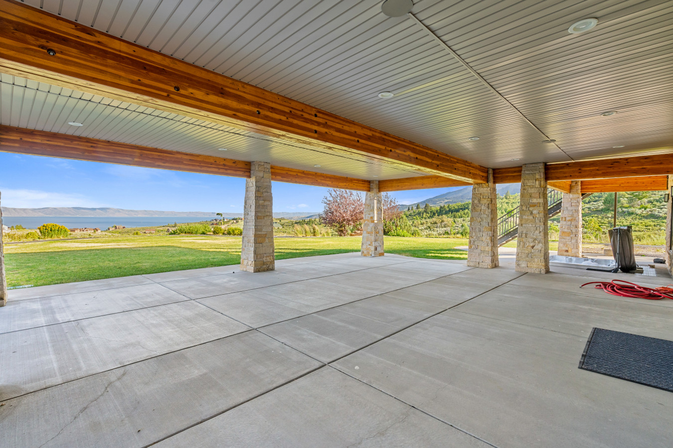 Spacious Back Deck with Firepit, Grill, Smoker and Tables. Back Yard and patio.