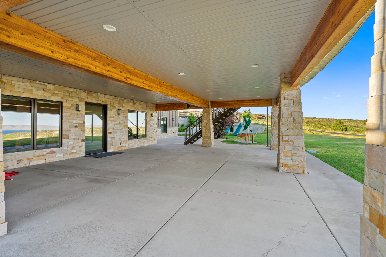 Spacious Back Deck with Firepit, Grill, Smoker and Tables. Back Yard and patio.
