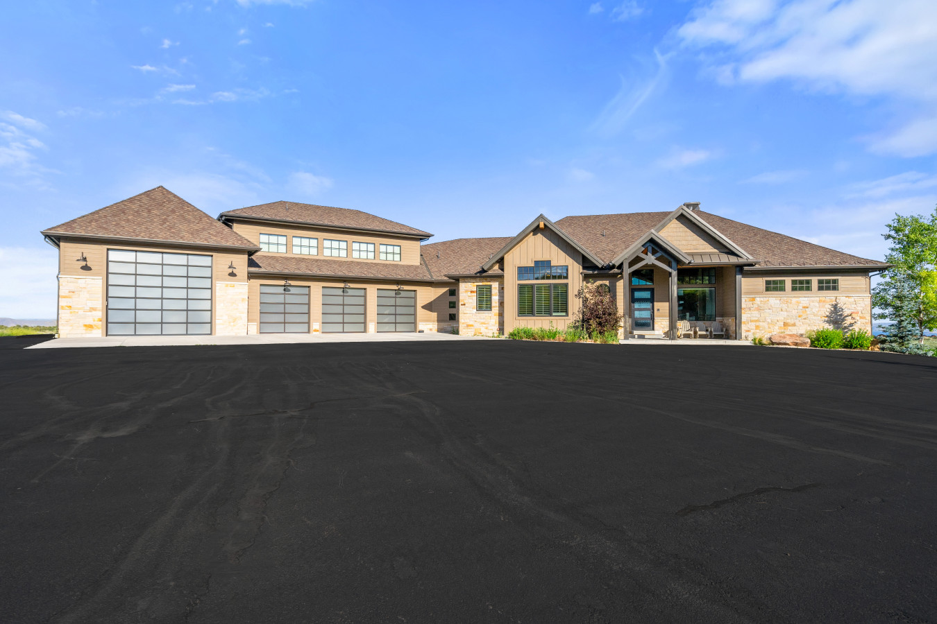 Cabin Front with 3 garage bays and plenty of parking