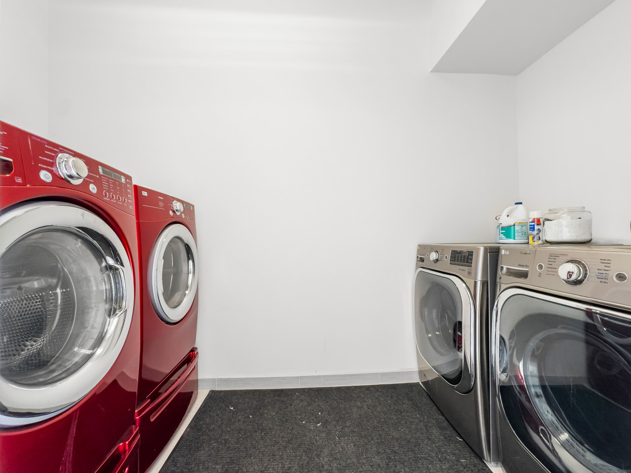 Laundry Room with Two sets of Laundry Machines off garage