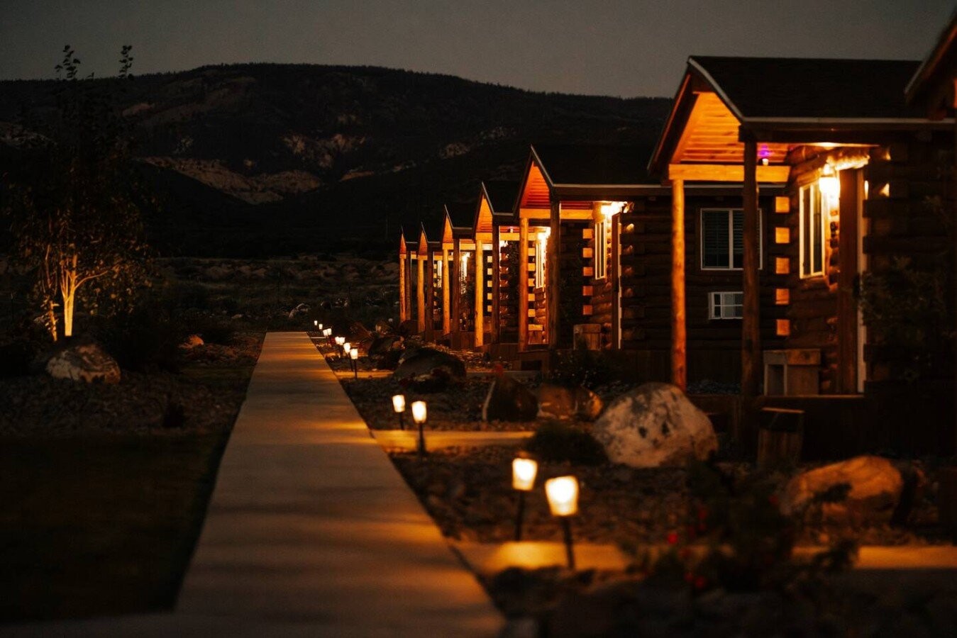 Thousand Lake Lodge cabins glowing at dusk